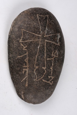 China, along the Silk Route. Stone Tablet with Nestorian Cross, 14th century, Excavated from Qorghas County, ancient Alimalik City, © Xinjiang Uygur Autonomous Region Museum Collection.